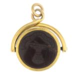 An early Victorian 18ct gold bloodstone and carnelian heraldic intaglio spinner fob.Length 2.5cms.