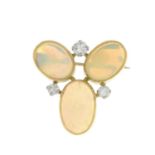 An 18ct gold opal and diamond brooch.