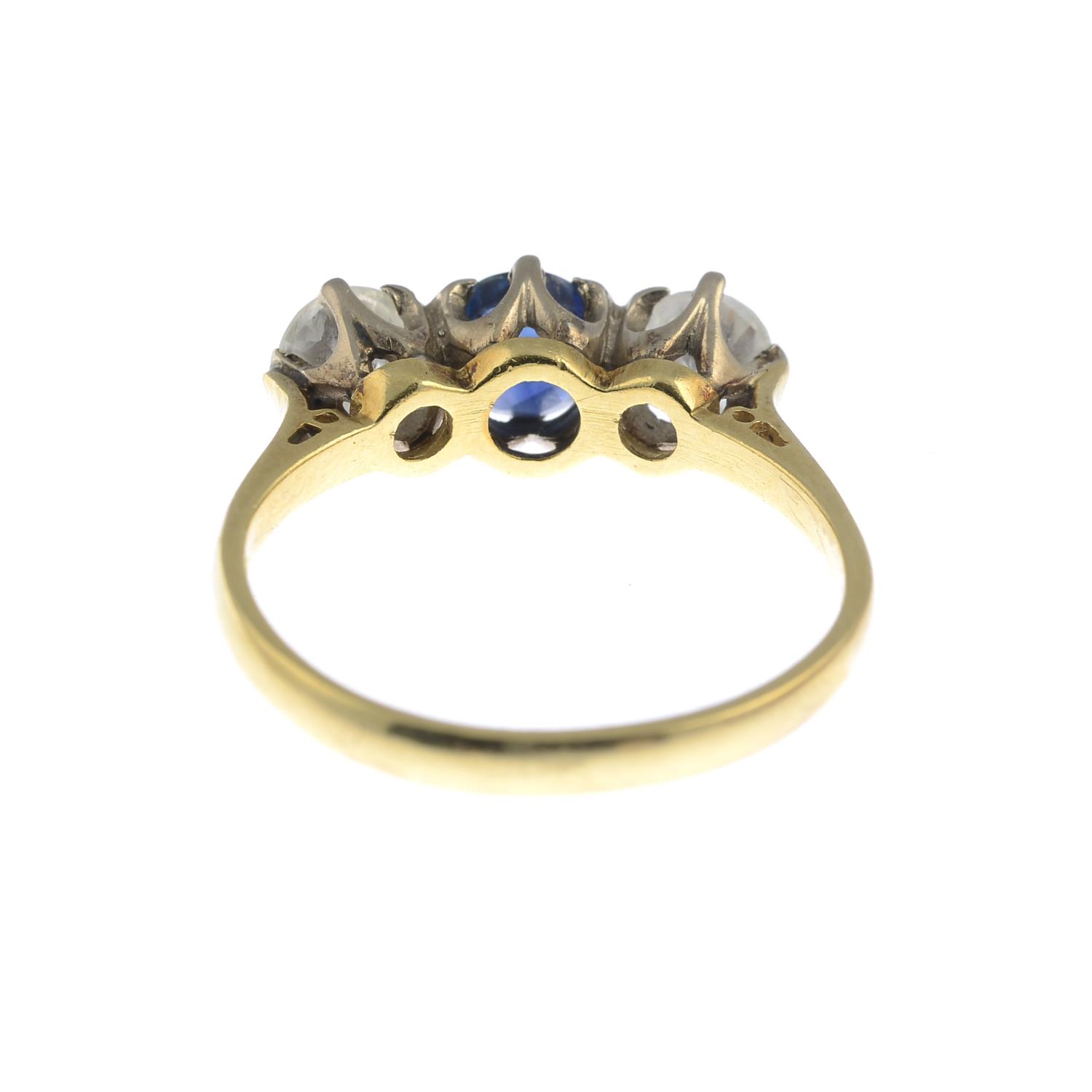 An 18ct gold diamond and sapphire three-stone ring.Estimated total diamond weight 0.80ct, - Image 3 of 3