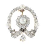 An early 20th century platinum and gold natural pearl and diamond brooch.