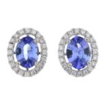 A pair of sapphire and diamond cluster earrings.Total sapphire weight 1.73cts.Total diamond weight