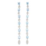 A pair of topaz and diamond drop earrings.