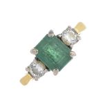 An 18ct gold emerald and diamond three-stone ring.Emerald calculated weight 1ct,