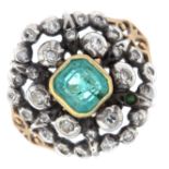 An emerald and diamond cluster ring.Emerald calculated weight 0.90ct,