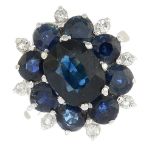 An 18ct gold sapphire and diamond cluster ring.Principal sapphire calculated weight 1.65cts,