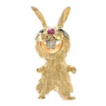 A diamond and gem-set bunny brooch.Estimated total diamond weight 0.15ct.Stamped 14K.Length 5cms.