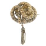 A late Victorian gold knot and tassel brooch.Length 6.5cms.