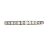 A diamond bar brooch.Estimated total diamond weight 2cts,