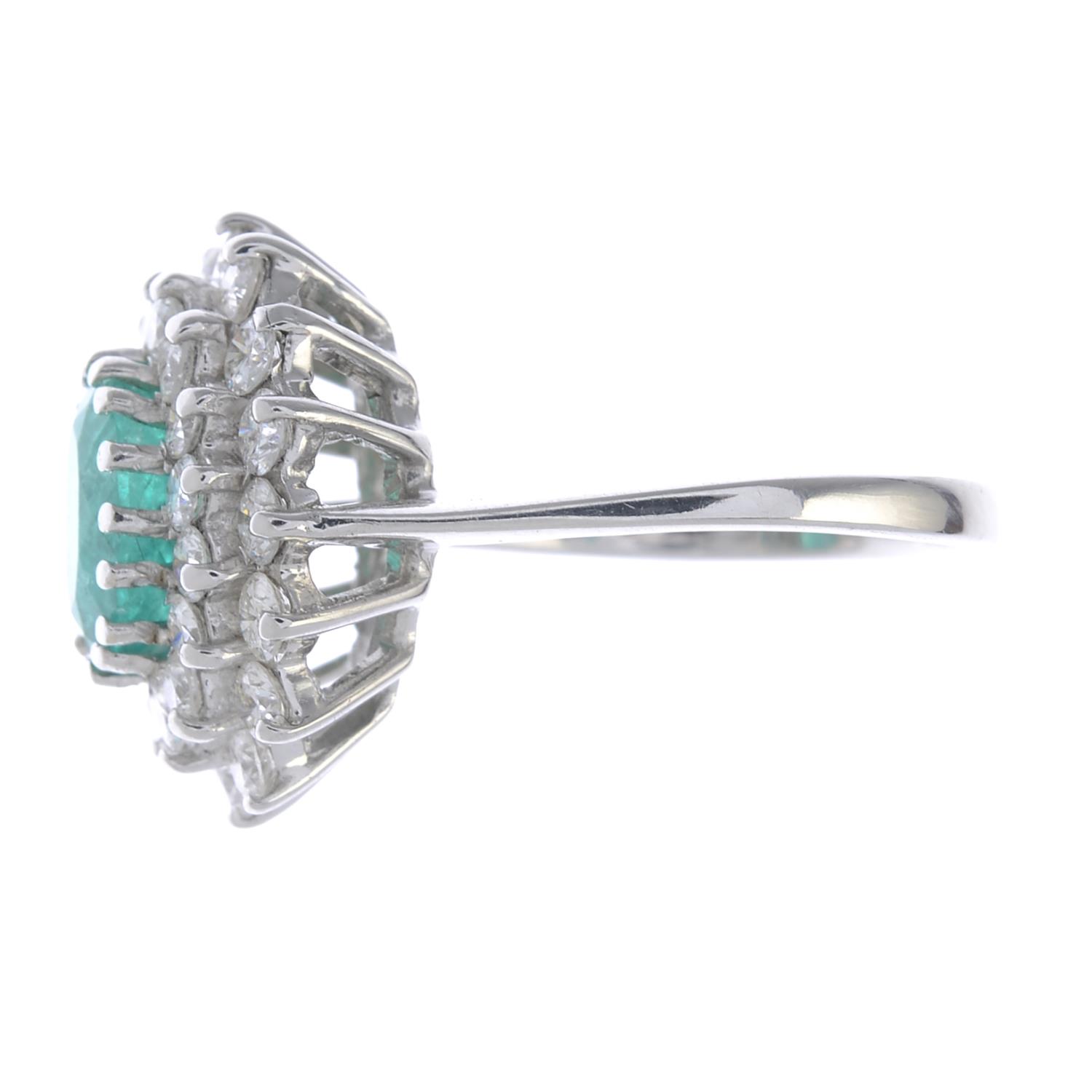 An 18ct gold emerald and diamond cluster ring. - Image 2 of 4