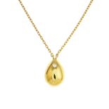 An 18ct gold diamond pendant, suspended from a trace-link chain.Signed Ritz.
