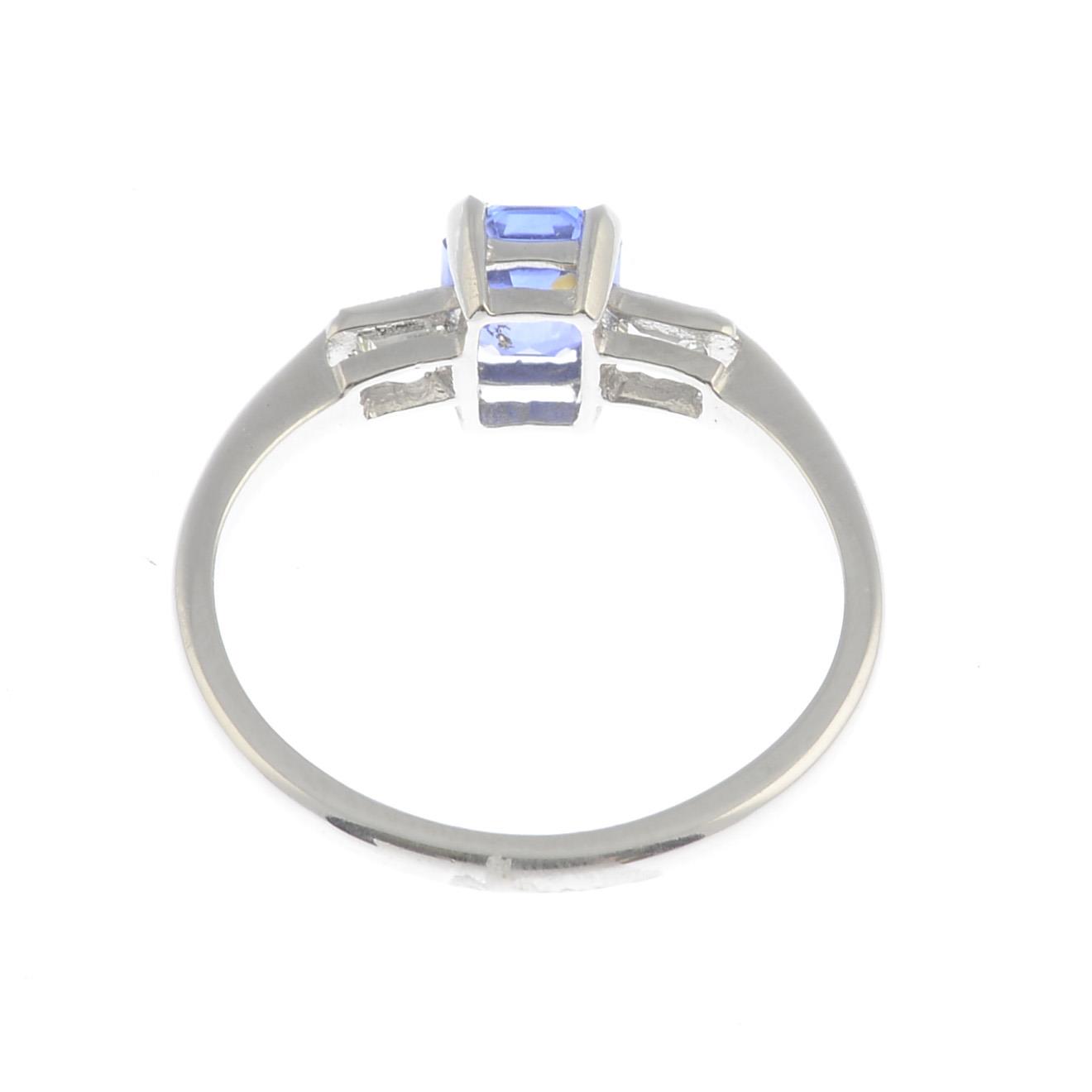 A sapphire and diamond dress ring.Sapphire weight 0.85ct. - Image 2 of 3