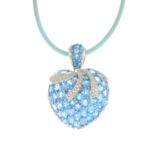 A topaz and diamond pendant, suspended from a blue cord.Esitmated total diamond weight 1.30cts.