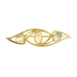 An 18ct gold oval opal cabochon three-stone brooch.Hallmarks for Birmingham, 1978.Length 4.8cms.