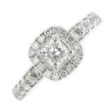 A platinum diamond cluster ring.Total diamond weight 0.74ct,