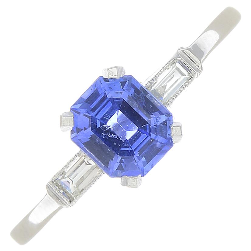 A sapphire and diamond dress ring.Sapphire weight 0.85ct.