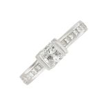 A platinum diamond ring.Estimated total diamond weight 0.50ct,