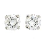 A pair of brilliant-cut diamond stud earrings.Estimated total diamond weight 0.70ct,