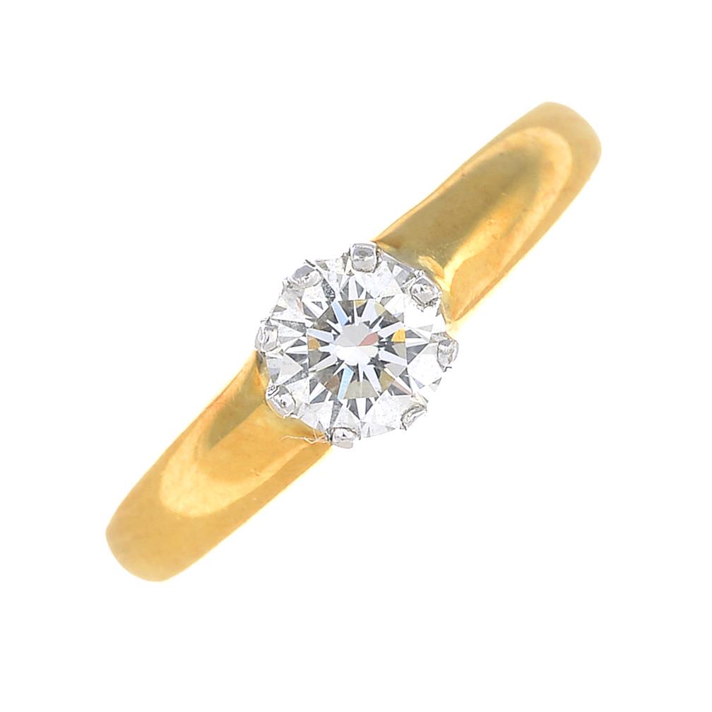 An 18ct gold brilliant-cut diamond single-stone ring.