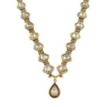 A diamond, paste and enamel necklace.Length of pendant 2cms.