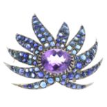 An amethyst and sapphire brooch.One sapphire deficient.Total sapphire weight 13cts.