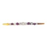 An Edwardian 22ct gold ruby and diamond bar brooch.Estimated total diamond weight 0.65ct,
