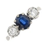 An 18ct gold sapphire and diamond three-stone ring.Sapphire calculated weight 1ct,