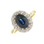 An 18ct gold sapphire and diamond cluster ring.Sapphire calculated weight 2cts,