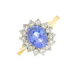 An 18ct gold sapphire and diamond cluster ring.Sapphire calculated weight 1.70cts,