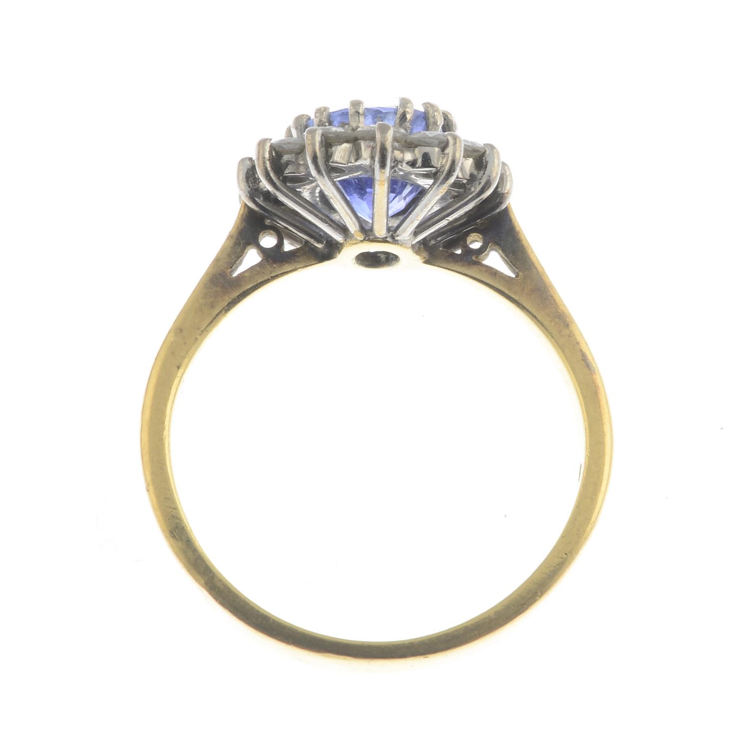 An 18ct gold sapphire and diamond cluster ring.Sapphire calculated weight 1.70cts, - Image 2 of 3