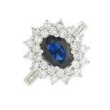 An 18ct gold sapphire and diamond cluster ring.