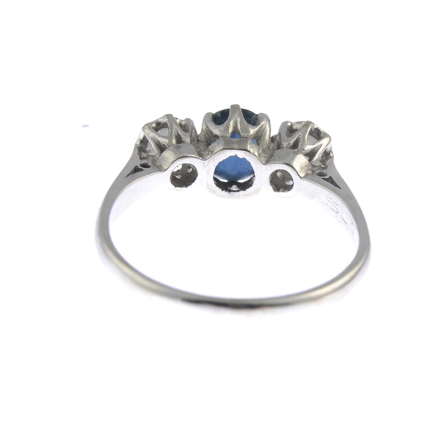 An 18ct gold sapphire and diamond three-stone ring.Sapphire calculated weight 1ct, - Image 3 of 3