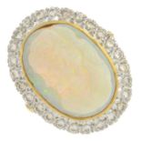 An opal and diamond cluster ring.Estimated total diamond weight 0.50ct.