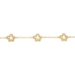 A diamond flower bracelet.Signed Ritz London,