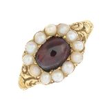 A mid 19th century gold garnet and split pearl ring.Ring size M.