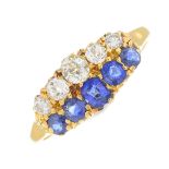 A sapphire and diamond dress ring.