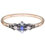 A late Victorian silver and 18ct gold, sapphire and diamond bangle.