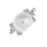 A cultured pearl and diamond ring.Diameter of cultured pearl 10.3mms.