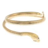 A mid 20th century 9ct gold ruby flexible snake bangle.