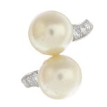 A cultured pearl and diamond dress ring.Diameter of cultured pearls 9.5 and 9.3mms.Estimated total