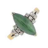 A jade and diamond ring.Jadeite calculated weight 2cts,