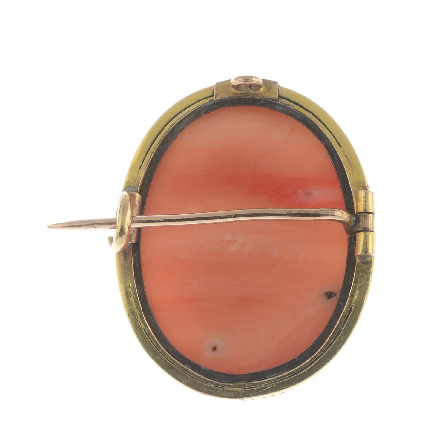 A coral cameo brooch.Estimated dimensions of coral 22 by 17.3 by 8.4mms.Length 2.5cms. - Image 2 of 2