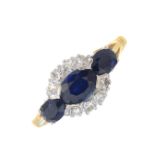 An 18ct gold sapphire and diamond dress ring.Estimated total diamond weight 0.10ct.Hallmarks for