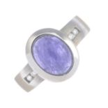 A 14ct gold purple sapphire cabochon and diamond dress ring.Sapphire calculated weight 2.24cts,