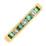 An 18ct gold emerald and diamond half eternity ring.