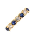 An 18ct gold sapphire and diamond seven-stone ring.