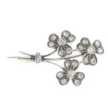 A diamond floral brooch.Estimated total diamond weight 0.40ct.Length 3cms.