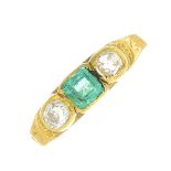 A late Victorian gold emerald and old-cut diamond three-stone ring.Emerald calculated weight