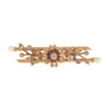 An early 20th century gold diamond and pearl brooch.Estimated old-cut diamond weight 0.10ct.