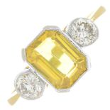 A yellow sapphire and diamond three-stone ring.Sapphire weight 1.60cts.