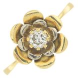 An 18ct gold diamond single-stone flower ring.Estimated diamond weight 0.20ct,